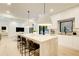 Spacious kitchen with a large island, modern pendant lighting, stainless steel appliances, and open layout at 6090 River Chase Cir, Atlanta, GA 30328