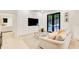 Bright living room with built-in entertainment center and stylish decor, opening to an outdoor patio at 6090 River Chase Cir, Atlanta, GA 30328