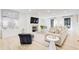 Stylish living room with elegant furniture, fireplace, and ample natural light at 6090 River Chase Cir, Atlanta, GA 30328
