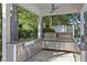 Covered outdoor kitchen with stainless steel appliances and granite countertops at 6090 River Chase Cir, Atlanta, GA 30328