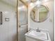 Tiled bathroom featuring a glass door shower, large mirror, and modern sink with countertop at 3089 Ranlo Dr, Atlanta, GA 30340
