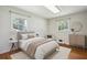 Serene bedroom with hardwood floors, natural light, and neutral decor creating a calming atmosphere at 3089 Ranlo Dr, Atlanta, GA 30340