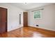 Well-lit bedroom with hardwood flooring, a closet, and access to an ensuite bathroom at 3089 Ranlo Dr, Atlanta, GA 30340