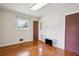 Bedroom with hardwood flooring, large window, and ample natural light at 3089 Ranlo Dr, Atlanta, GA 30340