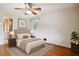 Cozy bedroom with hardwood floors, a ceiling fan, and generous natural light at 3089 Ranlo Dr, Atlanta, GA 30340