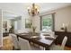 Dining room with hardwood floors, a table set for six, and large windows at 3089 Ranlo Dr, Atlanta, GA 30340