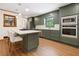 Modern kitchen features stainless steel appliances, olive green cabinets, and marble countertops at 3089 Ranlo Dr, Atlanta, GA 30340
