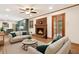 Cozy living room with a brick fireplace and an open view to the kitchen at 3089 Ranlo Dr, Atlanta, GA 30340