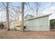 View of the home's backyard featuring a small deck and a siding exterior with a brick foundation at 3406 Blackberry Ln, Villa Rica, GA 30180