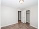 Bedroom with wood-look flooring and a closet featuring ample storage space at 3406 Blackberry Ln, Villa Rica, GA 30180