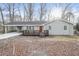 Charming single-story home featuring a carport, a cozy front porch, and a well-maintained yard at 3406 Blackberry Ln, Villa Rica, GA 30180