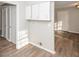 Hallway with wood-look flooring and built-in cabinets providing ample storage space at 3406 Blackberry Ln, Villa Rica, GA 30180
