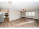 Bright and airy living room with hardwood floors open to a kitchen with stainless steel appliances at 3406 Blackberry Ln, Villa Rica, GA 30180
