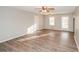 Spacious living room featuring hardwood floors, a ceiling fan, and plenty of natural light at 3406 Blackberry Ln, Villa Rica, GA 30180
