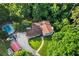 Aerial shot of a home with a backyard pool, lush greenery, and a spacious lot at 4648 Danna Dr, Austell, GA 30106