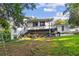 Large backyard with lawn and two-story home featuring a covered outdoor space at 4648 Danna Dr, Austell, GA 30106