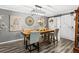 Inviting dining room with modern lighting and stylish decor with barn doors in view at 4648 Danna Dr, Austell, GA 30106