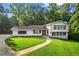 Charming two-story home with beautiful curb appeal and a well-manicured lawn at 4648 Danna Dr, Austell, GA 30106