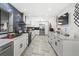 Bright kitchen with white cabinets, marble countertops, and stainless steel appliances at 4648 Danna Dr, Austell, GA 30106