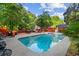 Refreshing backyard pool surrounded by lush greenery and a relaxing patio area at 4648 Danna Dr, Austell, GA 30106