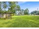 Expansive backyard featuring a swing set with lush green grass at 205 Cobb St, Palmetto, GA 30268