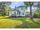 Spacious backyard with a wooden deck perfect for outdoor entertaining and partially fenced-in yard at 205 Cobb St, Palmetto, GA 30268