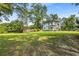 Overiew of expansive backyard featuring a playset and greenery at 205 Cobb St, Palmetto, GA 30268
