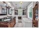 Bathroom boasts a double vanity, a soaking tub, and a tiled shower, exuding luxury at 205 Cobb St, Palmetto, GA 30268