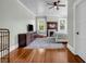 Open bedroom layout with wood floors, a fireplace, and abundant natural light at 205 Cobb St, Palmetto, GA 30268