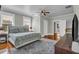Large bedroom with hardwood floors, a ceiling fan, and ample space at 205 Cobb St, Palmetto, GA 30268