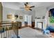 Bedroom with white fireplace, hardwood floors, and natural light at 205 Cobb St, Palmetto, GA 30268