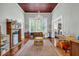 Bonus room featuring hardwood floors, a fireplace, and a view into the office at 205 Cobb St, Palmetto, GA 30268