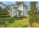 Elegant two-story home with striking columns, a relaxing covered porch, and well-maintained landscaping at 205 Cobb St, Palmetto, GA 30268