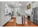 Kitchen featuring hardwood floors, an island, and a view into the living area at 205 Cobb St, Palmetto, GA 30268