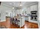 Well-appointed kitchen with an island, modern stainless steel appliances, and bright white cabinets at 205 Cobb St, Palmetto, GA 30268
