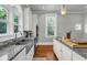 Kitchen featuring granite countertops, stainless steel appliances, and bright lighting at 205 Cobb St, Palmetto, GA 30268