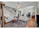 Spacious living room with large rug and high ceilings offering an elegant and comfortable ambiance at 205 Cobb St, Palmetto, GA 30268