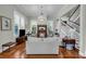 Bright living room featuring hardwood floors, a decorative fireplace, and a stunning chandelier at 205 Cobb St, Palmetto, GA 30268