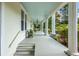 Long porch with white columns and blue ceiling at 205 Cobb St, Palmetto, GA 30268