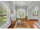 Charming sunroom with a dining table, bench seating, and ample natural light at 205 Cobb St, Palmetto, GA 30268