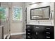 Bright bathroom with a glass enclosed shower, window, and a modern vanity at 4971 Fairhaven Ne Way, Roswell, GA 30075