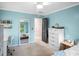 Bedroom with full size bed and an attached bathroom with view of a backyard at 4971 Fairhaven Ne Way, Roswell, GA 30075