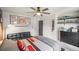 Cozy bedroom with sports memorabilia, a dark dresser, and a futon at 4971 Fairhaven Ne Way, Roswell, GA 30075