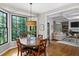 Kitchen dining area featuring a large window with black frames and view to living room at 4971 Fairhaven Ne Way, Roswell, GA 30075
