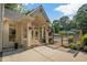 The exterior of this home features a gated entrance to the pool with a decorative archway at 4971 Fairhaven Ne Way, Roswell, GA 30075