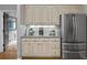 Functional kitchen with stainless steel refrigerator and under-cabinet lighting at 4971 Fairhaven Ne Way, Roswell, GA 30075