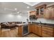 This kitchen features hardwood floors, granite countertops, light wood cabinets, and stainless steel appliances at 4971 Fairhaven Ne Way, Roswell, GA 30075