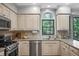 Updated kitchen featuring stainless steel appliances and natural light at 4971 Fairhaven Ne Way, Roswell, GA 30075