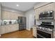 Spacious kitchen with stainless steel appliances and ample cabinet space at 4971 Fairhaven Ne Way, Roswell, GA 30075