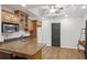 This kitchen features hardwood floors, granite countertops, and light wood cabinets at 4971 Fairhaven Ne Way, Roswell, GA 30075